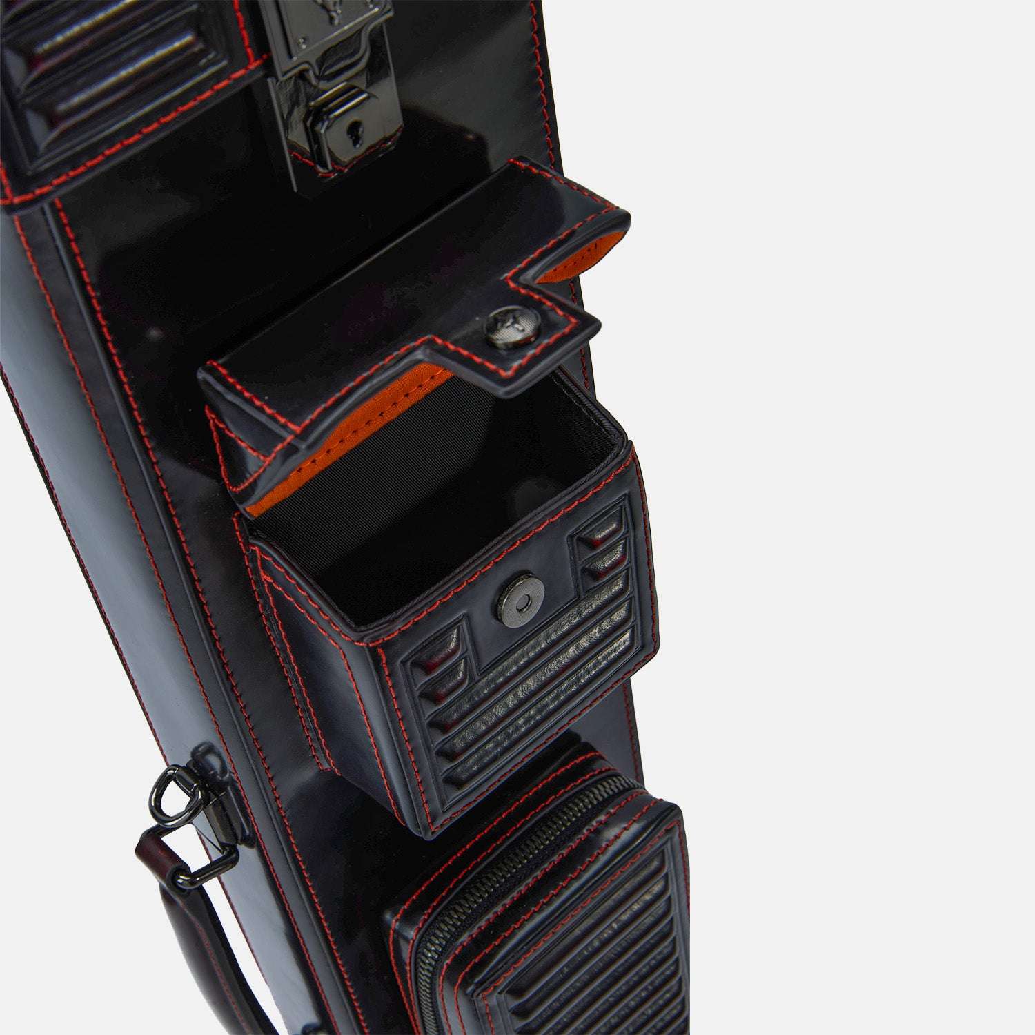 Black leather cue case with red stitching on a white background