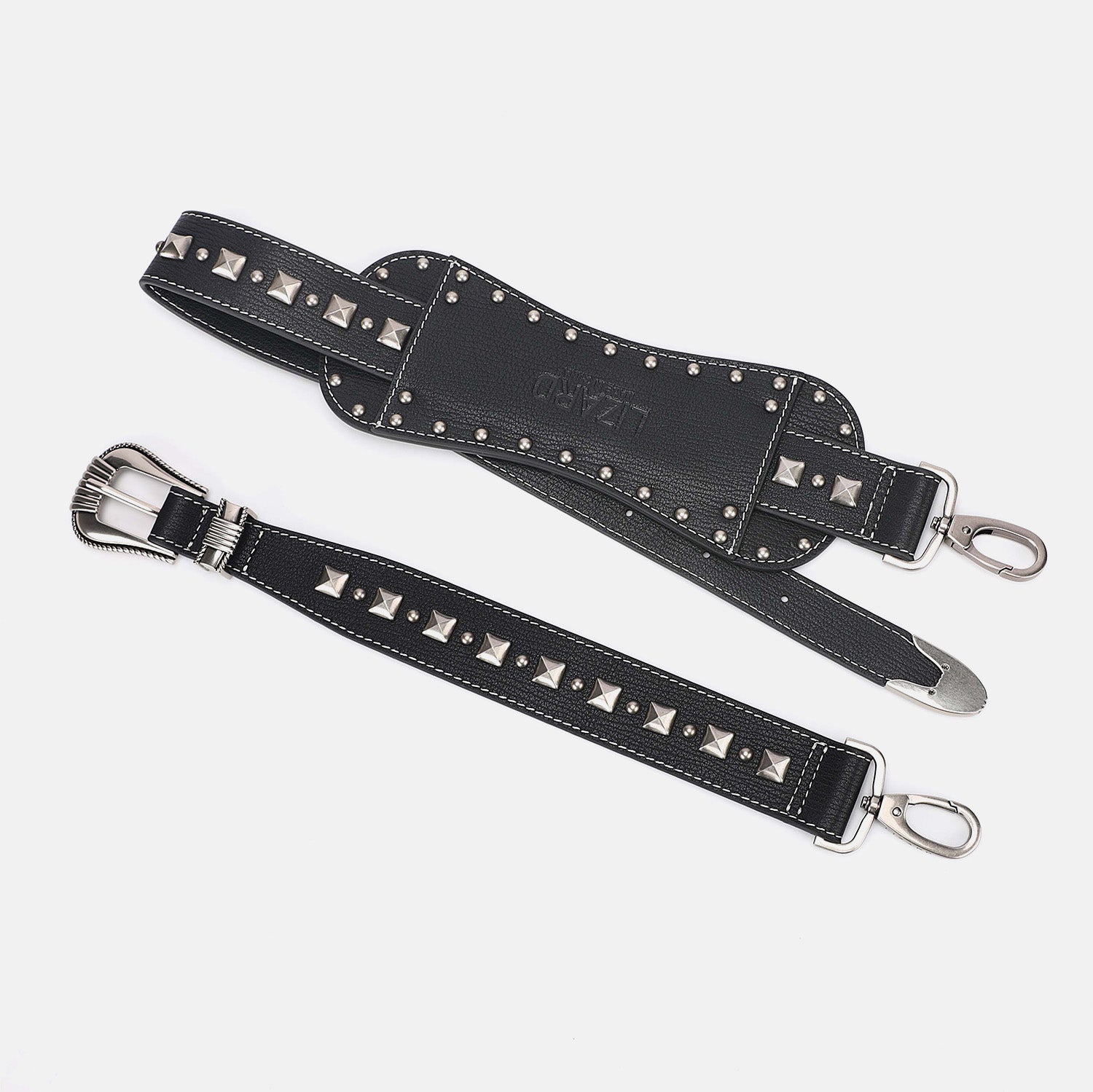 Black leather belt with silver studs and buckles on a light gray background