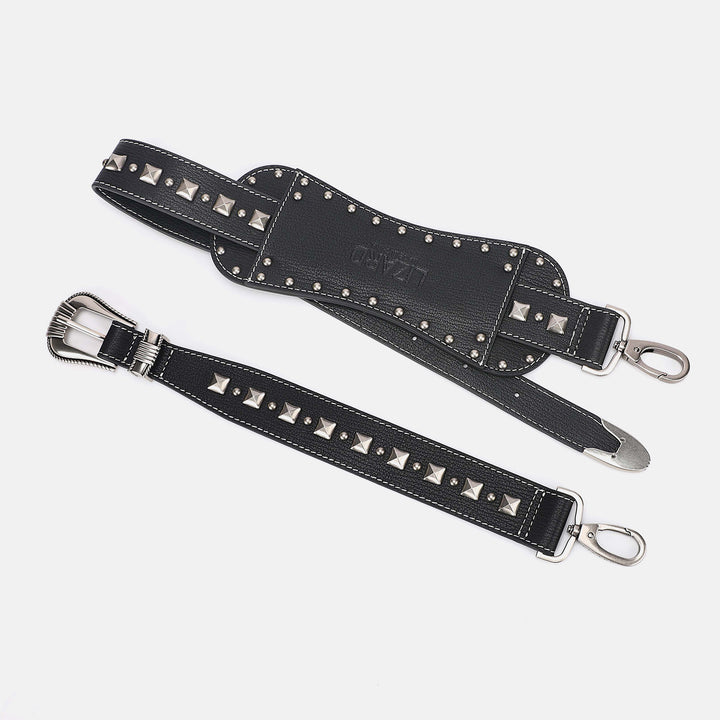 Black leather belt with silver studs and buckles on a light gray background