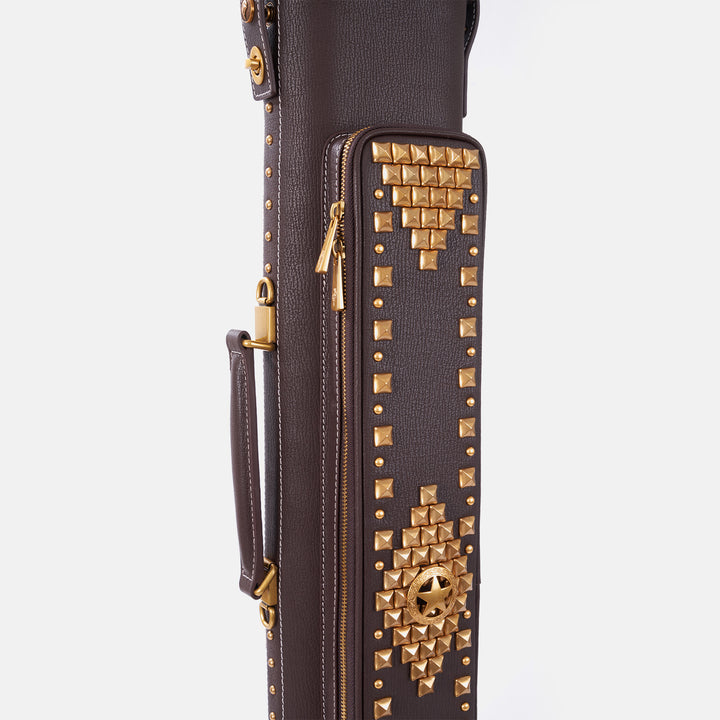 Dark brown leather cue case featuring intricate gold stud geometric patterns and a vintage design, vertical front view.