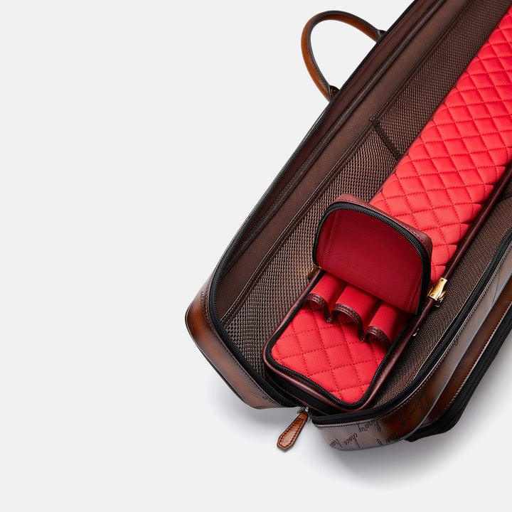 A red inner bag placed in a brown billiard cue case