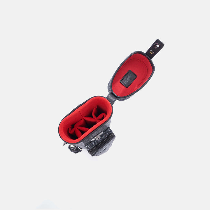 Black and red  with open cue case on a white background