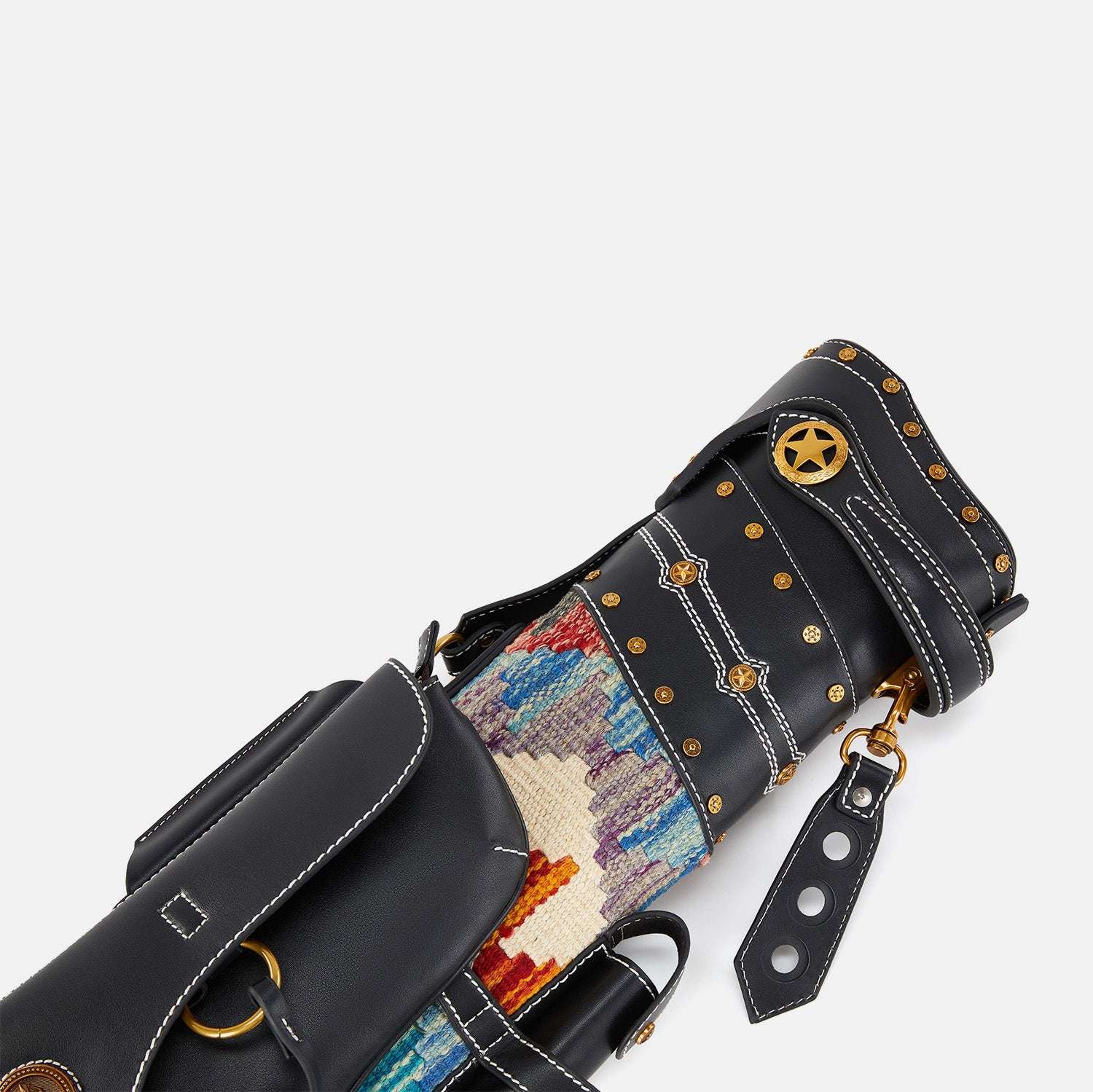 Close-up of a black cue case with colorful interior and gold studs on a white background